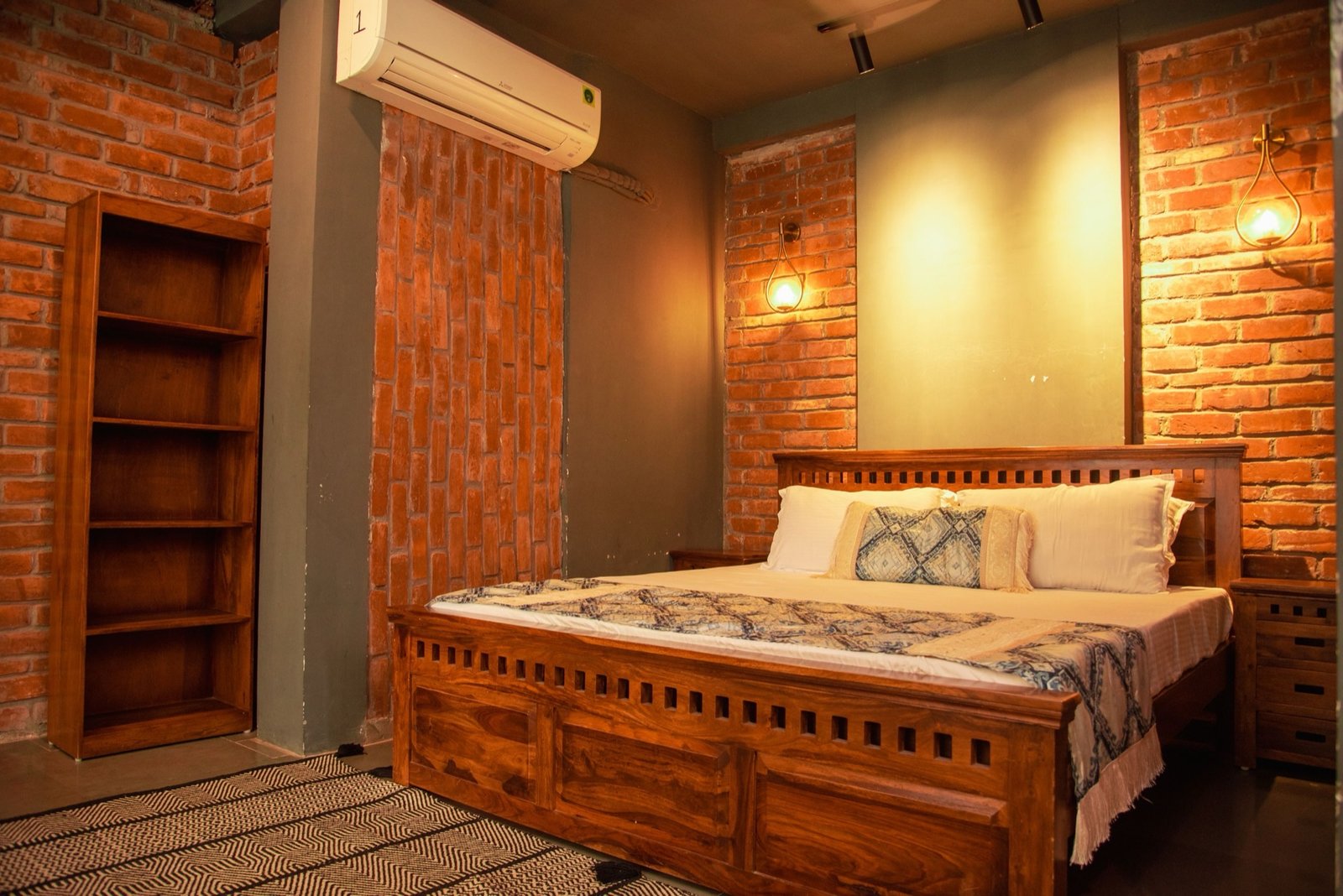 Villa B bedroom — exposed brick king room at We Woods Farm farmhouse near Delhi Manesar