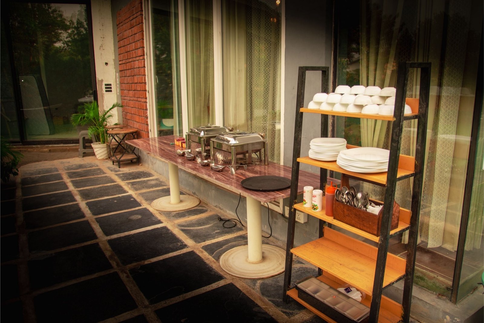 Outdoor buffet setup with chafing dishes — We Woods Farm farm dining Gurgaon