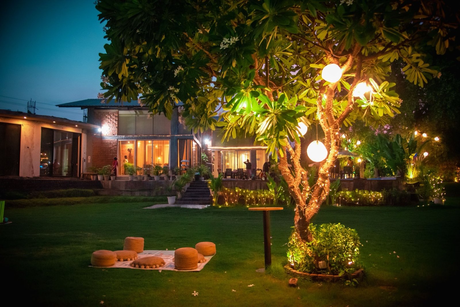 We Woods Farm night garden — farmhouse near Gurgaon Manesar