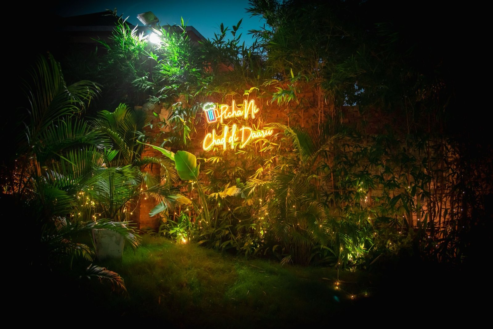 Neon sign garden at night — We Woods Farm Manesar Gurgaon