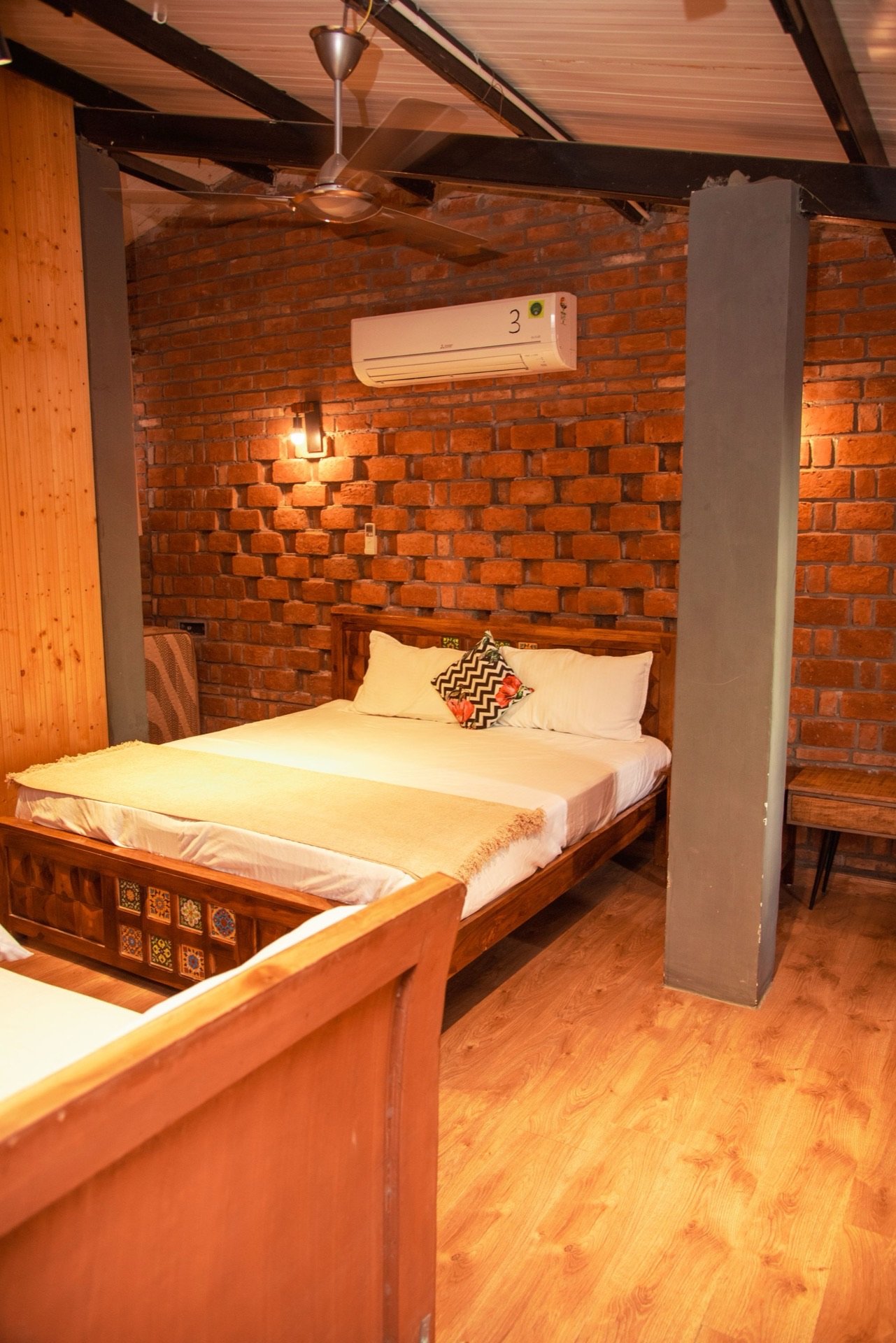 Rustic villa bedroom with wooden beams — We Woods Farm farmhouse near Delhi Manesar